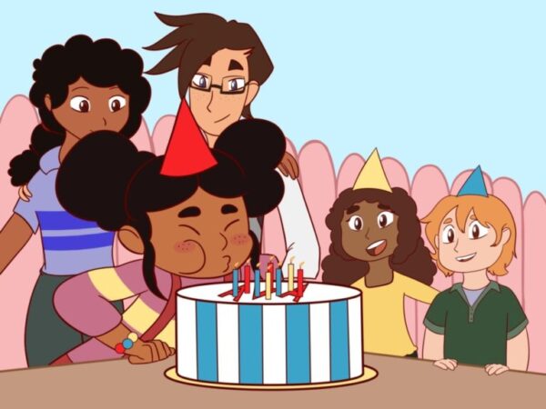 A group of people sitting around a cake.