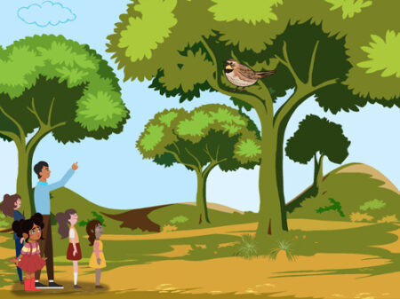 A group of people standing in front of trees.
