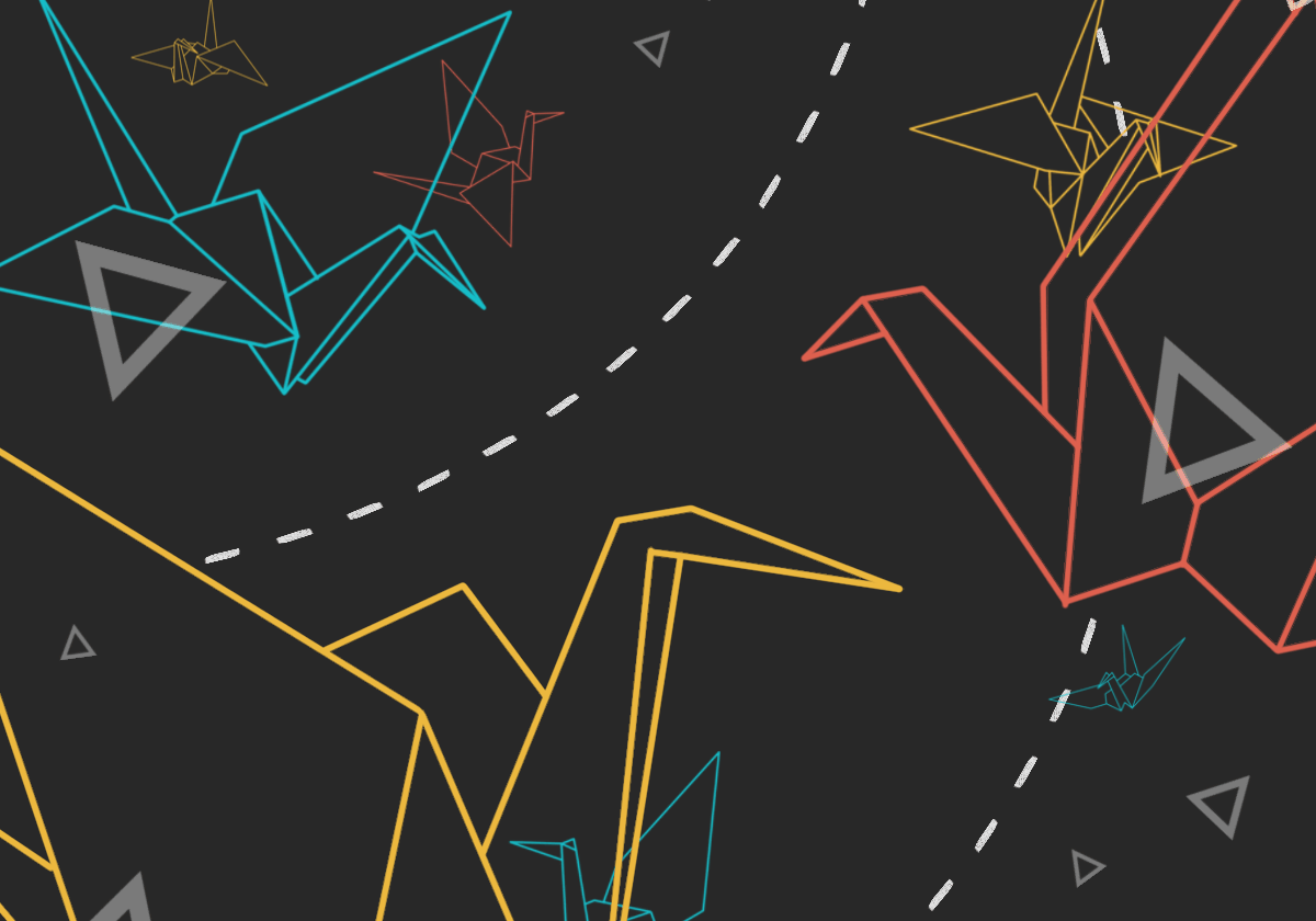 Colorful origami cranes on a dark background.